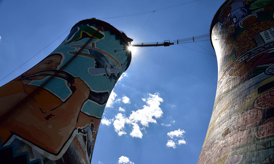 The Orlando Towers in Soweto south of Johannesburg were once the cooling towers of a now-defunct power station. Today the towers, brightly painted by South African artists, offer tourists spectacular views of the city - and bungee jumps off the central walkway. (South African Tourism, CC BY 2.0, via Flickr)